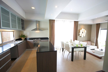 Kitchen, Dining and Living Area with Garden and Pool View